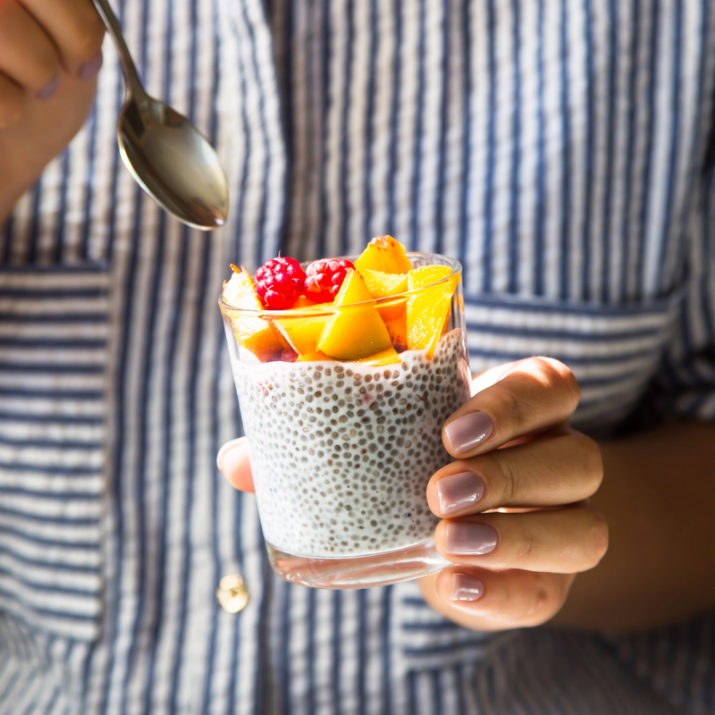 organic chia seeds in cup with fruit